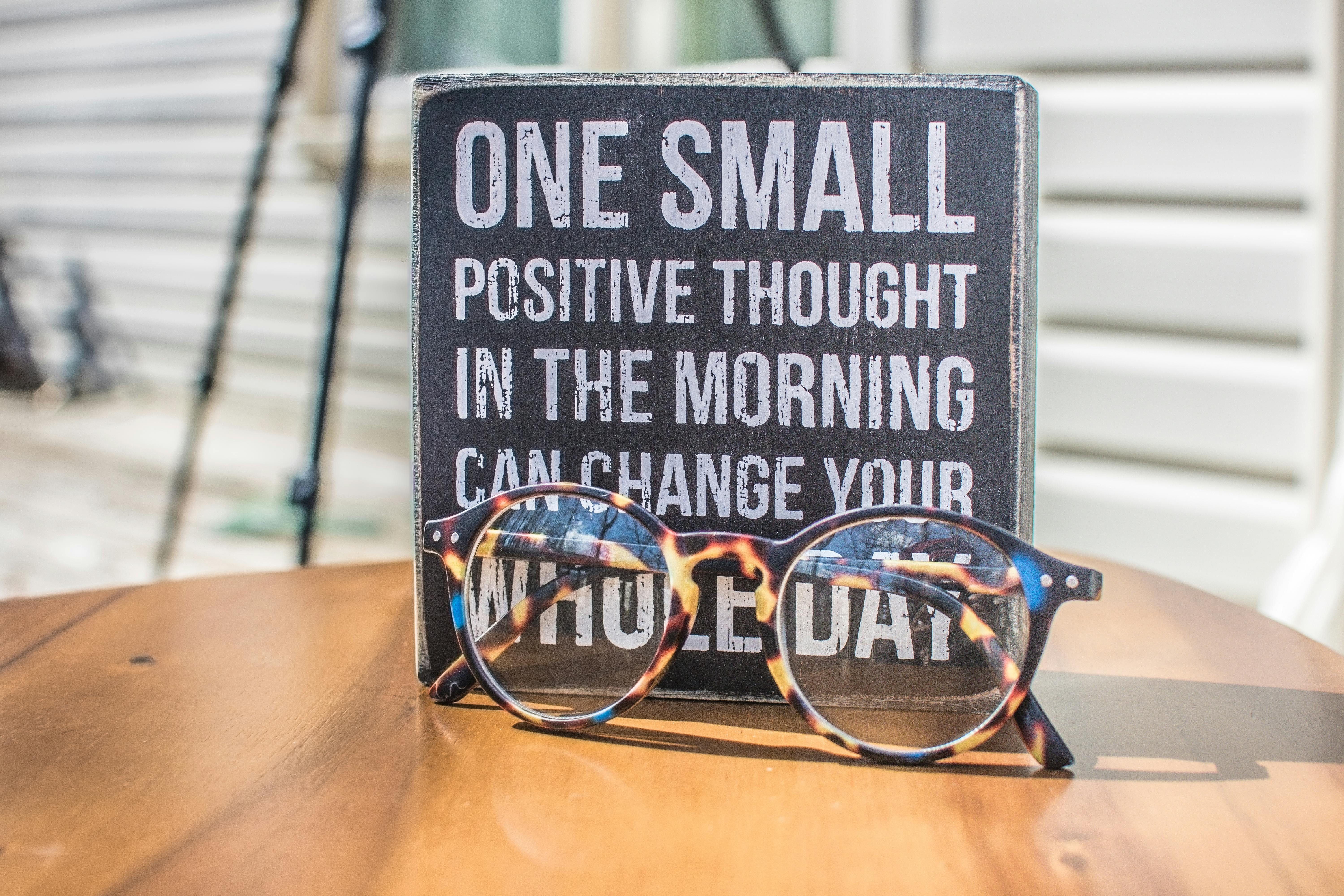 Inspirational wellness message with glasses symbolizing clarity and focus